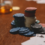 Why Small Wins in Lotteries Keep Players Hooked: The Role of Reinforcement